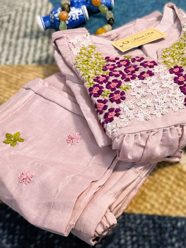 Elegant Pastel Kurti – Soft blush fabric with beautiful floral embroidery for a graceful everyday look